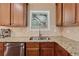 Stainless steel appliances, granite countertops and tile backsplash fill this efficiently designed kitchen at 2629 Muskeg Sw Ct, Atlanta, GA 30331