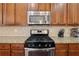 Stainless steel appliances with granite countertops and tile backsplash are just a few of the upgrades at 2629 Muskeg Sw Ct, Atlanta, GA 30331