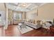 Stylish living room boasts hardwood floors, coffered ceilings, and comfortable seating arrangements at 2629 Muskeg Sw Ct, Atlanta, GA 30331