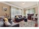 Cozy living space with hardwood floors, a bar area, and ample natural light at 2629 Muskeg Sw Ct, Atlanta, GA 30331