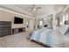 Spacious main bedroom suite boasts a tray ceiling, fireplace, sitting area, and a doorway leading to another room at 2629 Muskeg Sw Ct, Atlanta, GA 30331