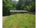 Quaint brick home on a lush, overgrown lot, offering privacy and potential at 5533 Glore Sw Dr, Mableton, GA 30126