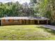 Charming brick home featuring red shutters, a well-manicured lawn, and a convenient carport at 5533 Glore Sw Dr, Mableton, GA 30126