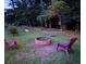 Private backyard featuring a fire pit and outdoor game area is great for entertainment at 7234 Post Rd, Winston, GA 30187