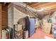 Unfinished basement view shows red painted concrete floor and exposed utilities at 7234 Post Rd, Winston, GA 30187