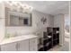Modern basement bathroom with a sleek vanity, decorative lighting, and linen storage for convenience at 7234 Post Rd, Winston, GA 30187