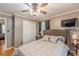 Comfortable bedroom featuring neutral walls, ceiling fan and a queen bed at 7234 Post Rd, Winston, GA 30187