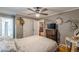 Bedroom with hardwood floors, ceiling fan, and ensuite bathroom access at 7234 Post Rd, Winston, GA 30187