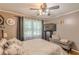 Comfortable bedroom featuring neutral walls, TV and a queen bed at 7234 Post Rd, Winston, GA 30187