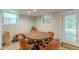 Cozy dining area featuring a vintage round table, leather chairs, and views of the outdoor at 7234 Post Rd, Winston, GA 30187