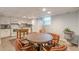 Dining area next to a kitchen featuring white cabinets, appliances, and unique textured ceilings at 7234 Post Rd, Winston, GA 30187