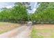 View of the gated driveway offering seclusion and privacy at 7234 Post Rd, Winston, GA 30187