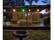 Cozy gazebo with outdoor dining area and grill, ideal for evening gatherings by the pool at 7234 Post Rd, Winston, GA 30187
