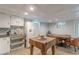 Cozy kitchen area features a decorative tile backsplash, metal ceiling, and breakfast nook at 7234 Post Rd, Winston, GA 30187