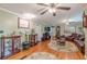 Spacious living room featuring hardwood floors, neutral walls, and ample natural light at 7234 Post Rd, Winston, GA 30187