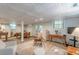 Open living room with textured ceilings, tile floors, an adjacent dining area, and lots of natural light at 7234 Post Rd, Winston, GA 30187