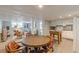 Open concept living space featuring a dining area, kitchen, and living area with natural light at 7234 Post Rd, Winston, GA 30187