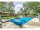 Large in-ground pool with a diving board and lounge chairs, perfect for outdoor relaxation at 7234 Post Rd, Winston, GA 30187
