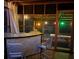 Stylish screened porch featuring a bar with seating and views of the outdoor space at 7234 Post Rd, Winston, GA 30187
