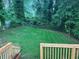 View of a backyard featuring manicured grass and mature trees at 876 Pinehurst Sw Ter, Atlanta, GA 30310