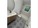 Bathroom features patterned tile floors, a new vanity, and shower-tub combo at 876 Pinehurst Sw Ter, Atlanta, GA 30310