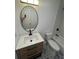 Updated bathroom features patterned tile floors, a new vanity, and shower-tub combo at 876 Pinehurst Sw Ter, Atlanta, GA 30310
