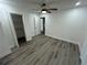 Spacious bedroom features modern ceiling fan and wood-look floors at 876 Pinehurst Sw Ter, Atlanta, GA 30310