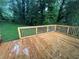 Wide-angle view of a wooden deck with a wooden railing overlooking a grassy yard at 876 Pinehurst Sw Ter, Atlanta, GA 30310