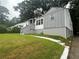 Charming home with a welcoming front yard, lush landscaping, and a traditional design at 876 Pinehurst Sw Ter, Atlanta, GA 30310