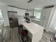 Bright, modern kitchen with white cabinets, stainless steel appliances, and a large island at 876 Pinehurst Sw Ter, Atlanta, GA 30310