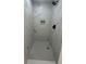 Tiled walk-in shower features a mosaic tile floor and a built-in niche at 876 Pinehurst Sw Ter, Atlanta, GA 30310