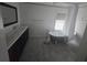 Bathroom with a vintage clawfoot tub, modern vanity, and tiled floors at 1048 Seals Rd, Dallas, GA 30157