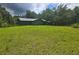 Charming home with a metal roof, green exterior, and a large grassy front yard at 1048 Seals Rd, Dallas, GA 30157