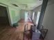View of the living room with hardwood floors, a wood burning stove, and a ceiling fan at 1048 Seals Rd, Dallas, GA 30157