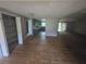 Open-concept living room with wood floors flowing into a view of the kitchen at 1048 Seals Rd, Dallas, GA 30157