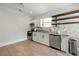 Modern kitchen features stainless steel appliances and ample cabinet space at 1057 Fortress Sw Ave, Atlanta, GA 30315