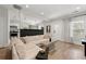 Bright living room featuring an open floor plan with a modern sectional and hardwood floors at 1057 Fortress Sw Ave, Atlanta, GA 30315
