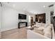 Comfortable living room with a sofa and a large screen television for entertainment at 1057 Fortress Sw Ave, Atlanta, GA 30315