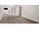 Spacious main bedroom with carpet, closet barn doors, and modern ensuite bathroom at 1057 Fortress Sw Ave, Atlanta, GA 30315