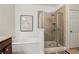 Bathroom with a glass enclosed shower, a separate soaking tub, and neutral colored tiles at 1986 Cobblestone Ne Cir, Atlanta, GA 30319