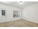 This carpeted room has a door to the outdoors and a window that provides plenty of sunlight at 1986 Cobblestone Ne Cir, Atlanta, GA 30319