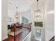 Elegant dining area with modern lighting, a wooden table, and large windows at 1986 Cobblestone Ne Cir, Atlanta, GA 30319