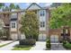Charming townhome with a brick facade, attached garage, and well-maintained landscaping at 1986 Cobblestone Ne Cir, Atlanta, GA 30319