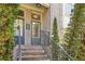 Inviting front entrance with a gray door, brick steps, and decorative plants at 1986 Cobblestone Ne Cir, Atlanta, GA 30319