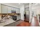 Modern kitchen with grey cabinets, stainless steel appliances, and hardwood floors at 1986 Cobblestone Ne Cir, Atlanta, GA 30319