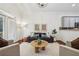 A comfortable living room featuring neutral colors, with hardwood floors, and a modern light fixture at 1986 Cobblestone Ne Cir, Atlanta, GA 30319