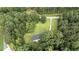 Overhead view of a secluded home surrounded by lush greenery and a long driveway at 3975 N Sharon Church N Rd, Loganville, GA 30052