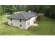 Aerial view of the back of the home, highlighting roof and surrounding trees at 3975 N Sharon Church N Rd, Loganville, GA 30052