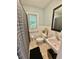 This is a beautiful bathroom with vanity, tile floors, and lots of light at 3975 N Sharon Church N Rd, Loganville, GA 30052