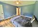 Spacious bedroom featuring wood floors and a large window at 3975 N Sharon Church N Rd, Loganville, GA 30052